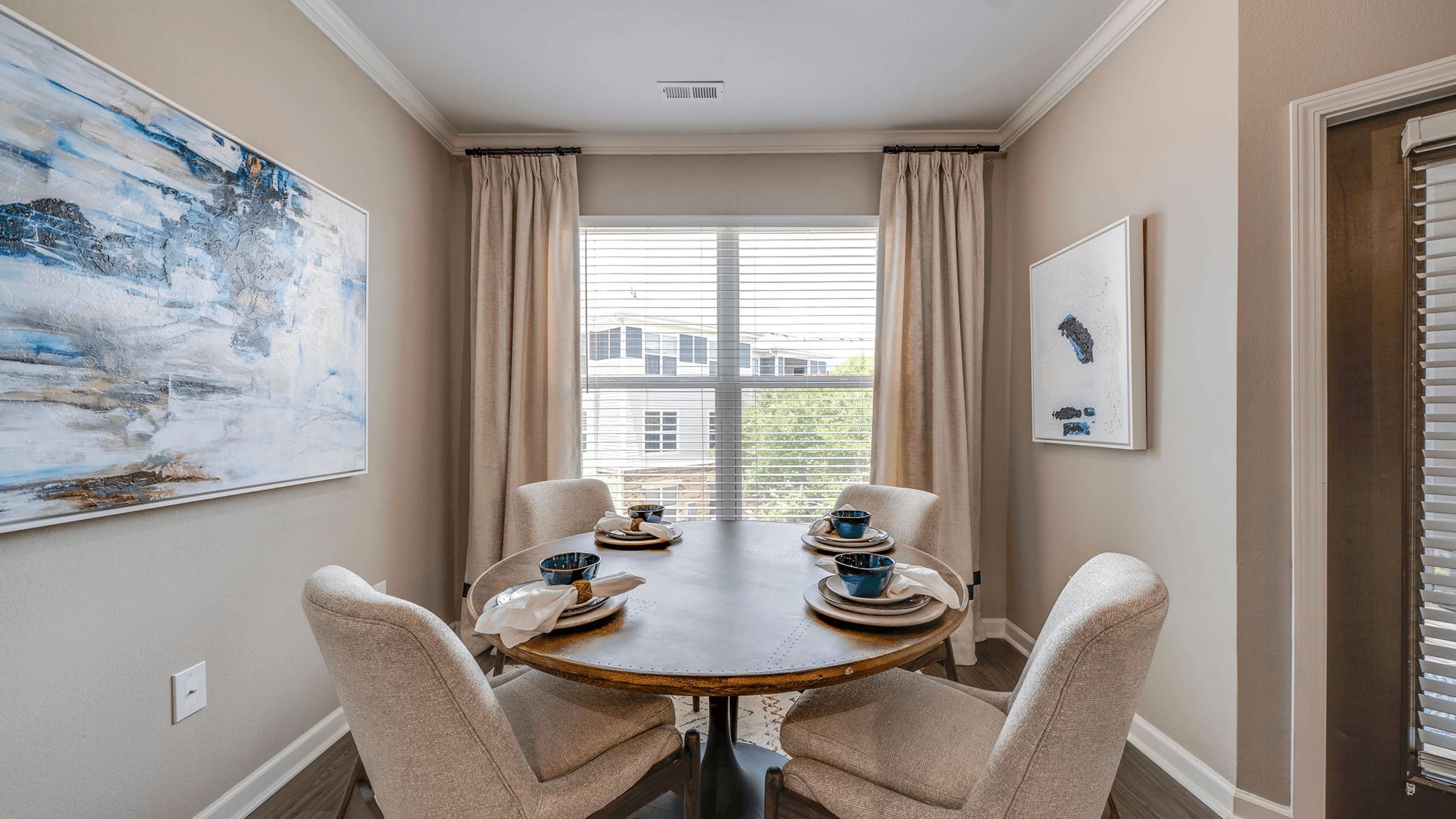 Hawthorne Davis Park apartment dining area with wood floors and a large window